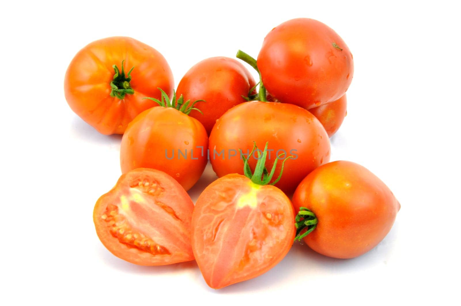 Fresh organic homegrown tomatoes on white background