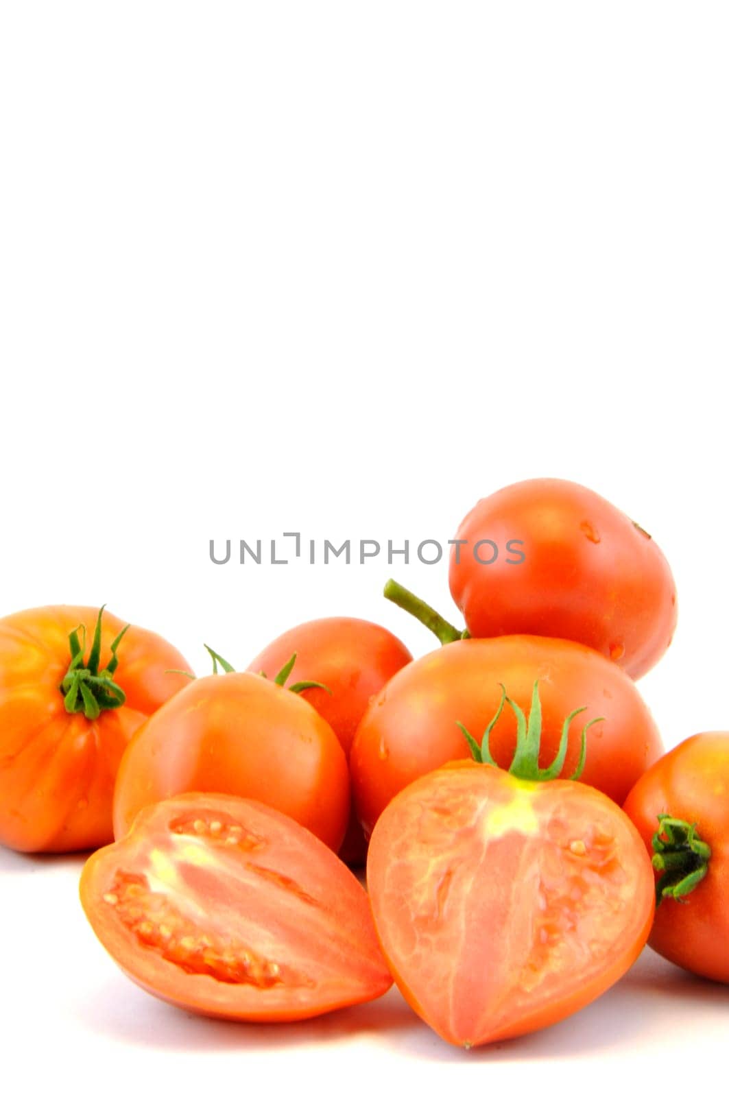 Fresh organic homegrown tomatoes on white background
