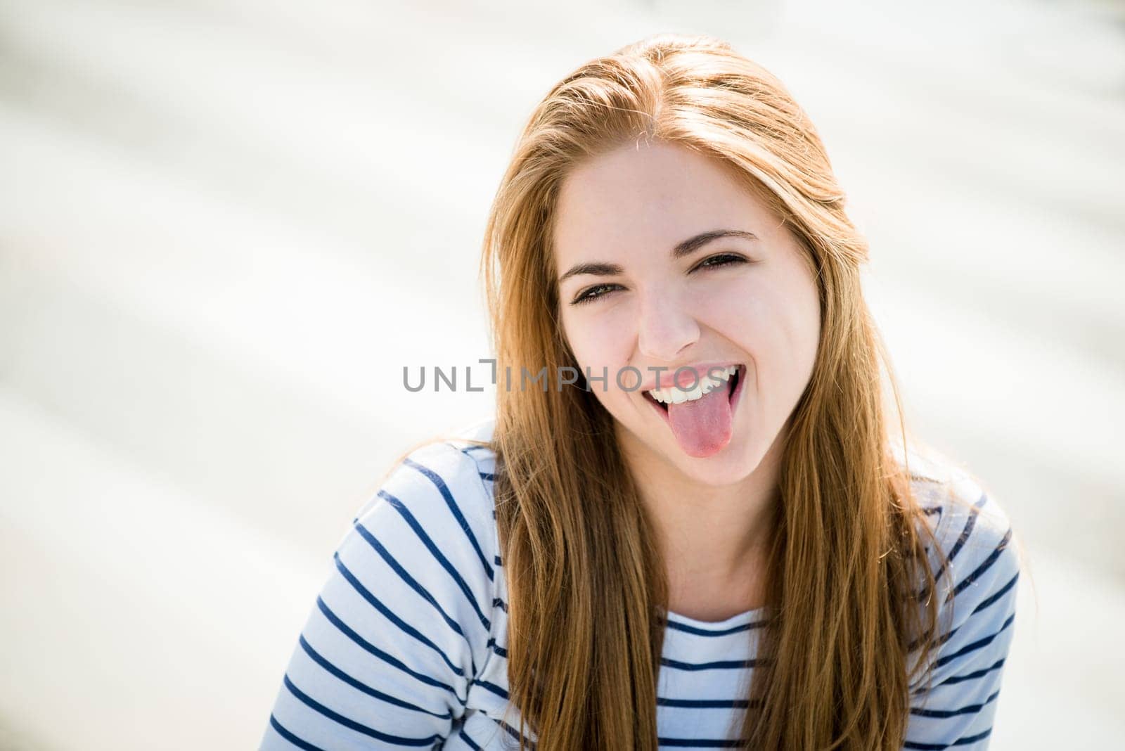 Teenager portrait - smiling girl outdoor on sunny day