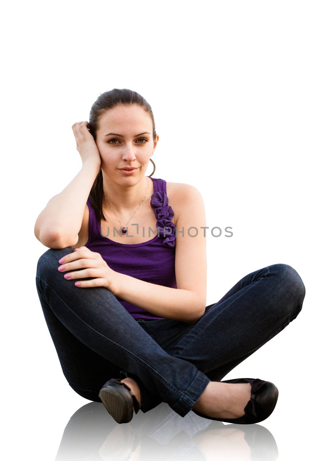 Portrait of young woman sitting on ground - isolated on white background