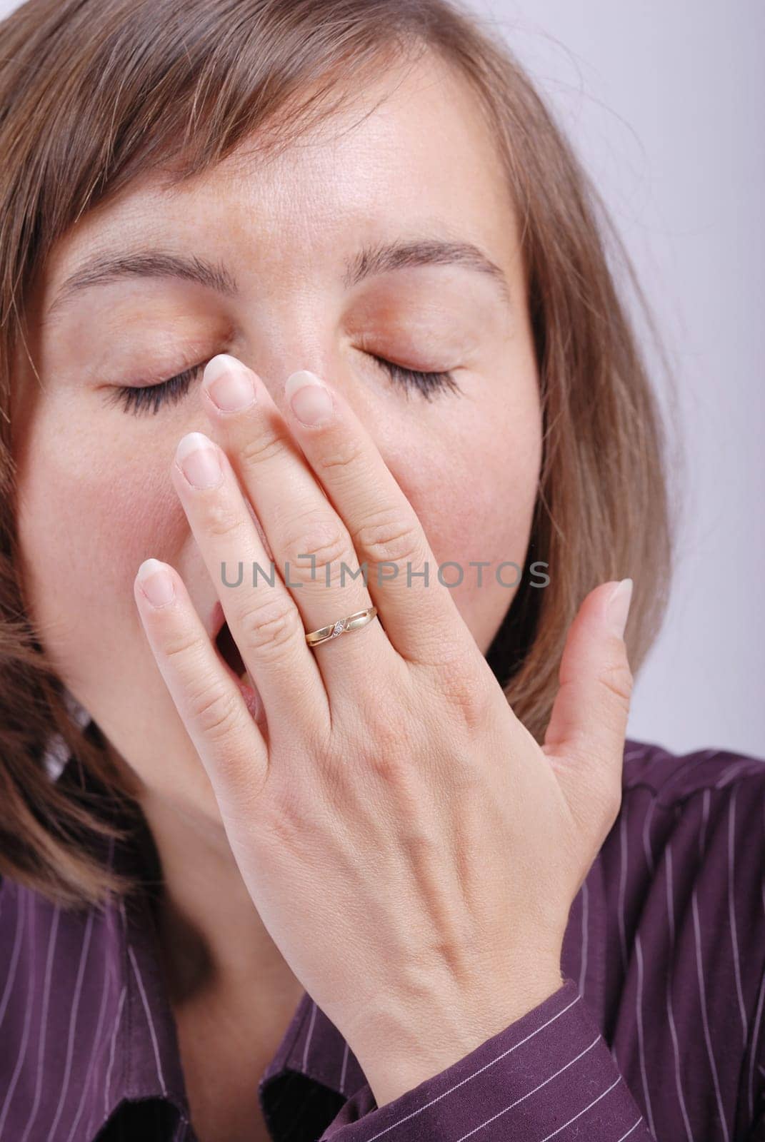 Young business woman yawning - detail