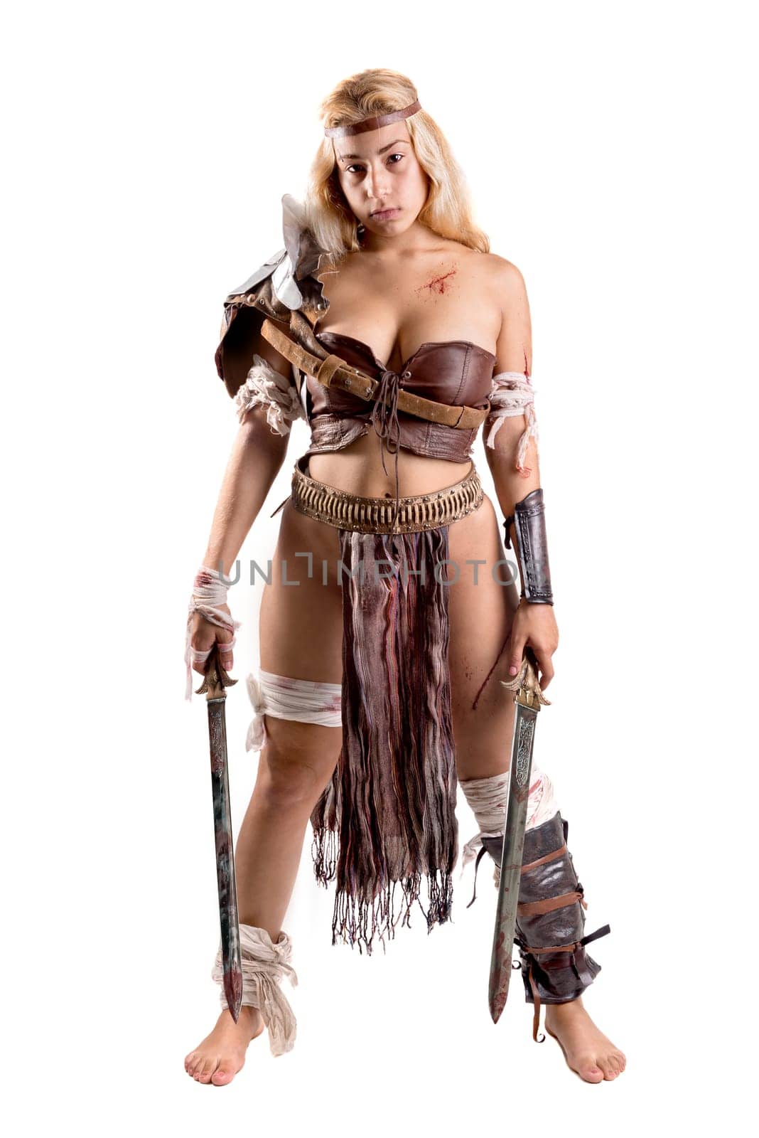 Ancient woman warrior or Gladiator posing with sword and shield, isolated in white