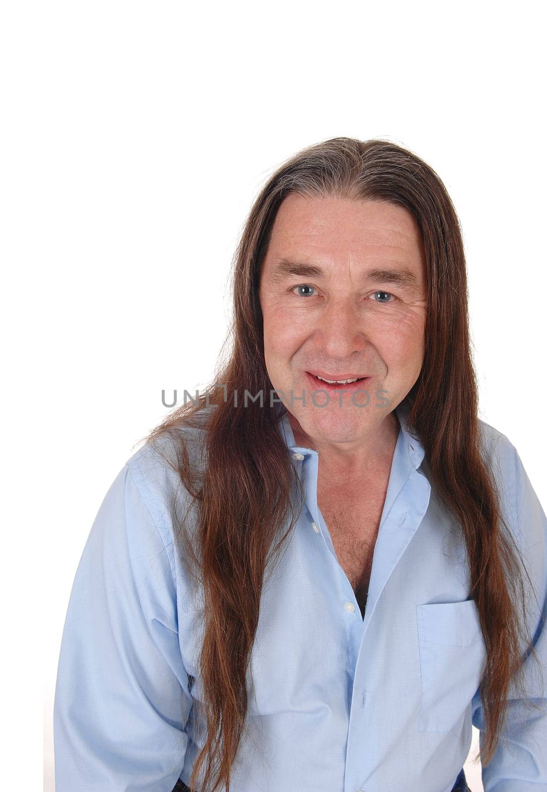 A handsome indigenous man smiling in a portrait shoot with his.long brunette hair, isolated for white background.
