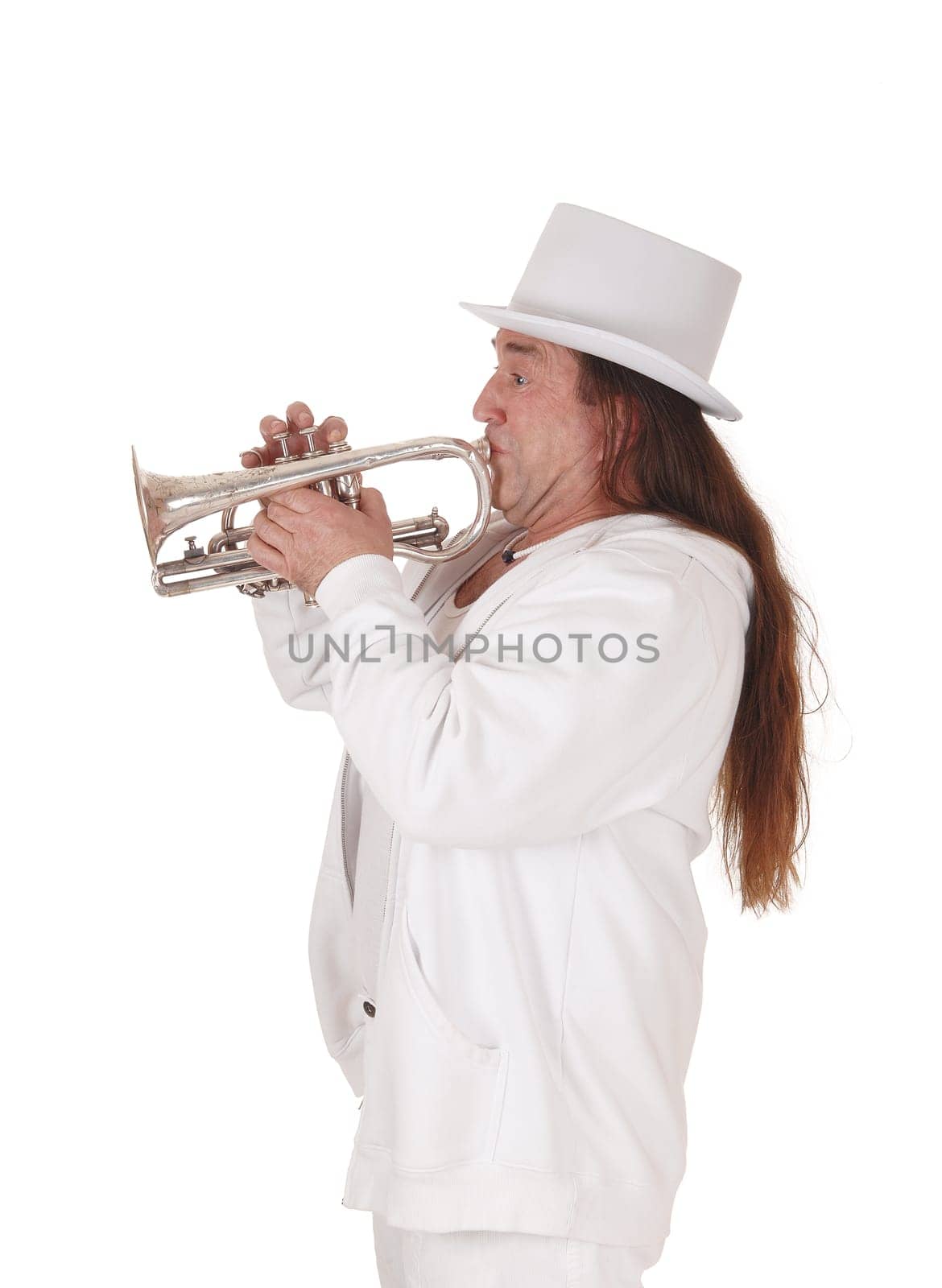 A middle age indigenous man standing in a white outfit and white hat.playing his trumpet with his long hair, isolated for white background.
