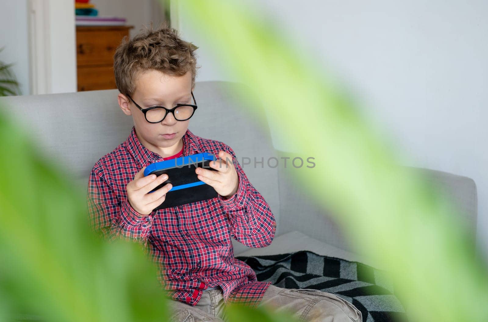 child boy playing with video game