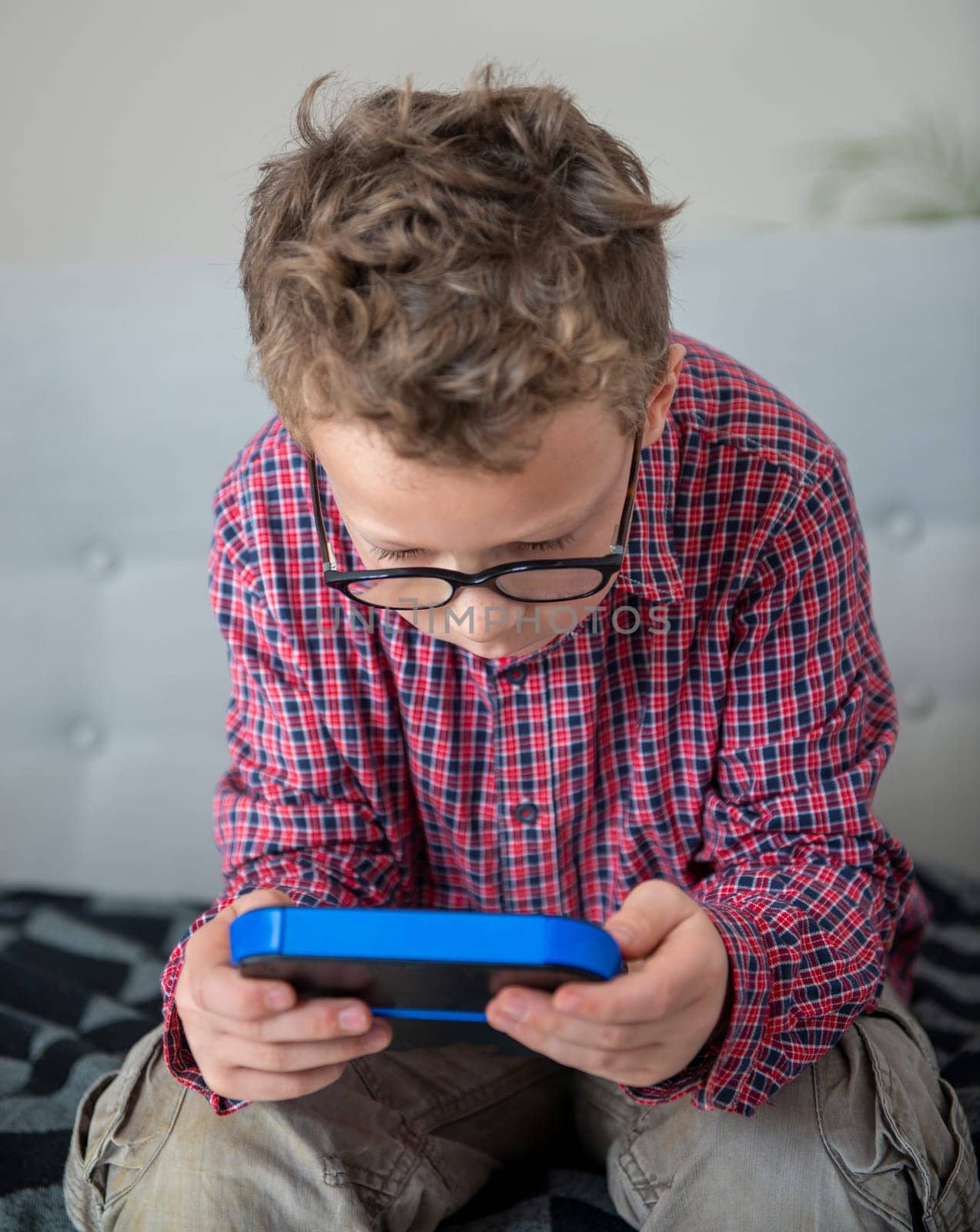 child boy playing with video game