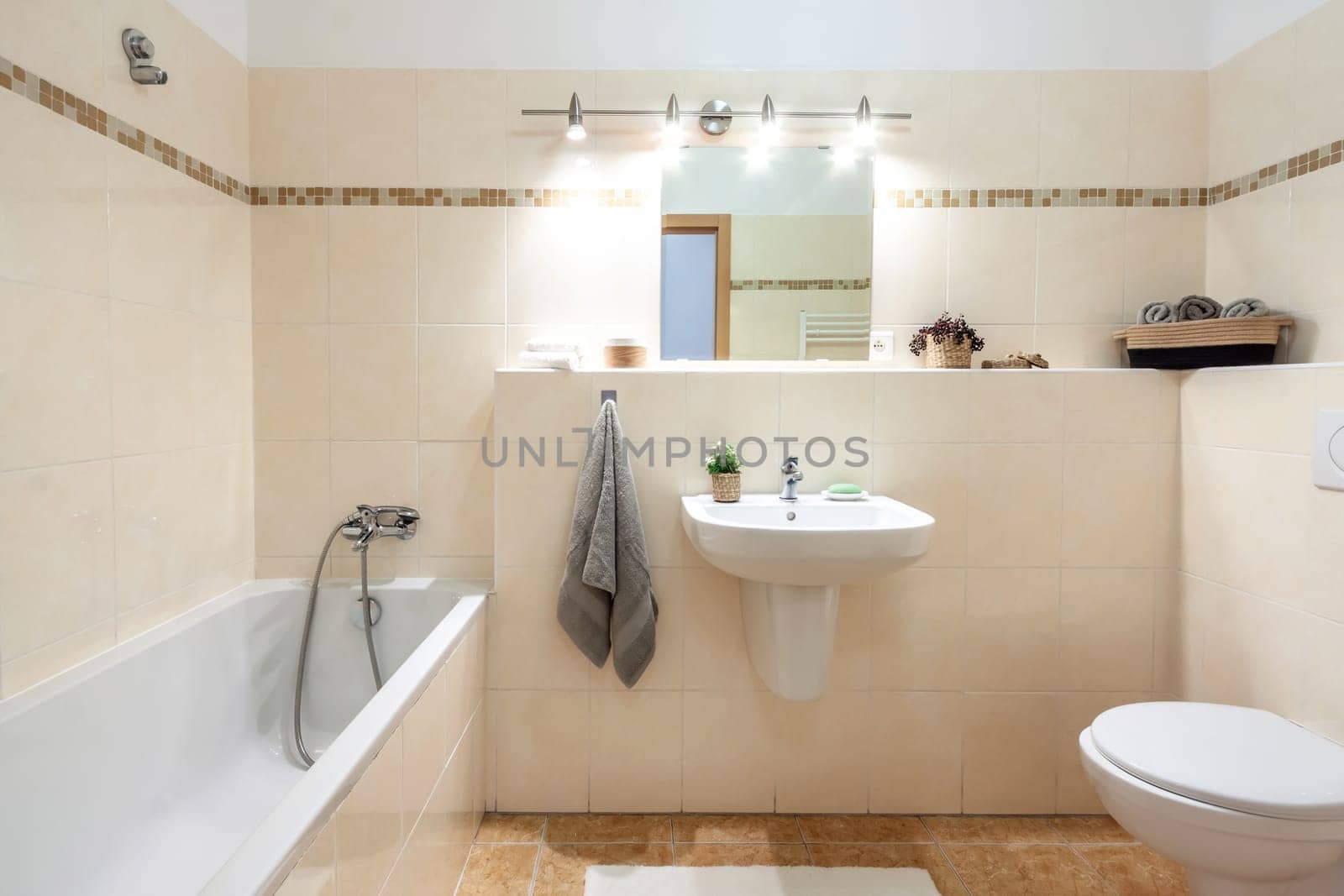 modern bathroom in the apartment. A glass shower door. High quality photo