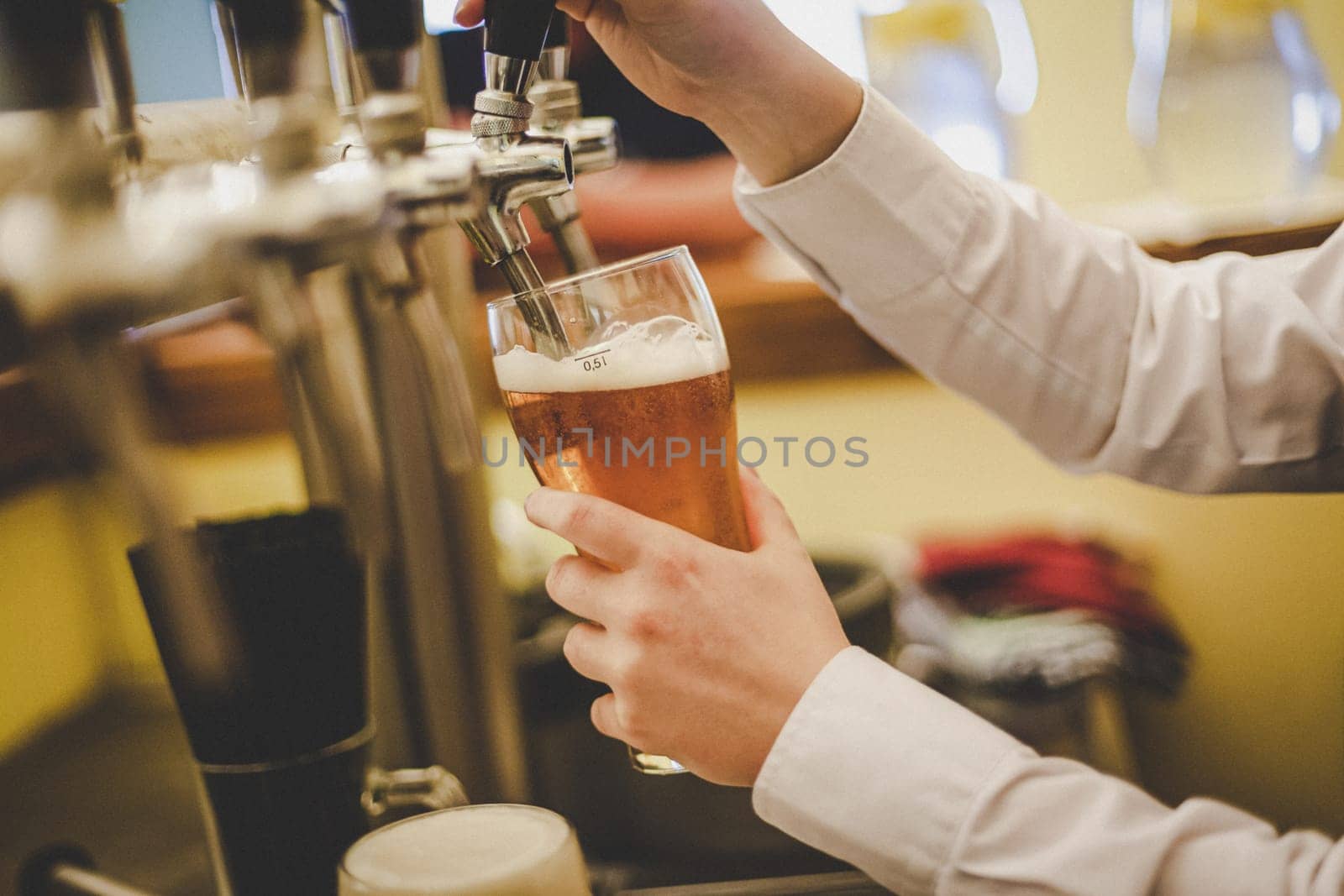 A hand holding a glass of wine. High quality photo
