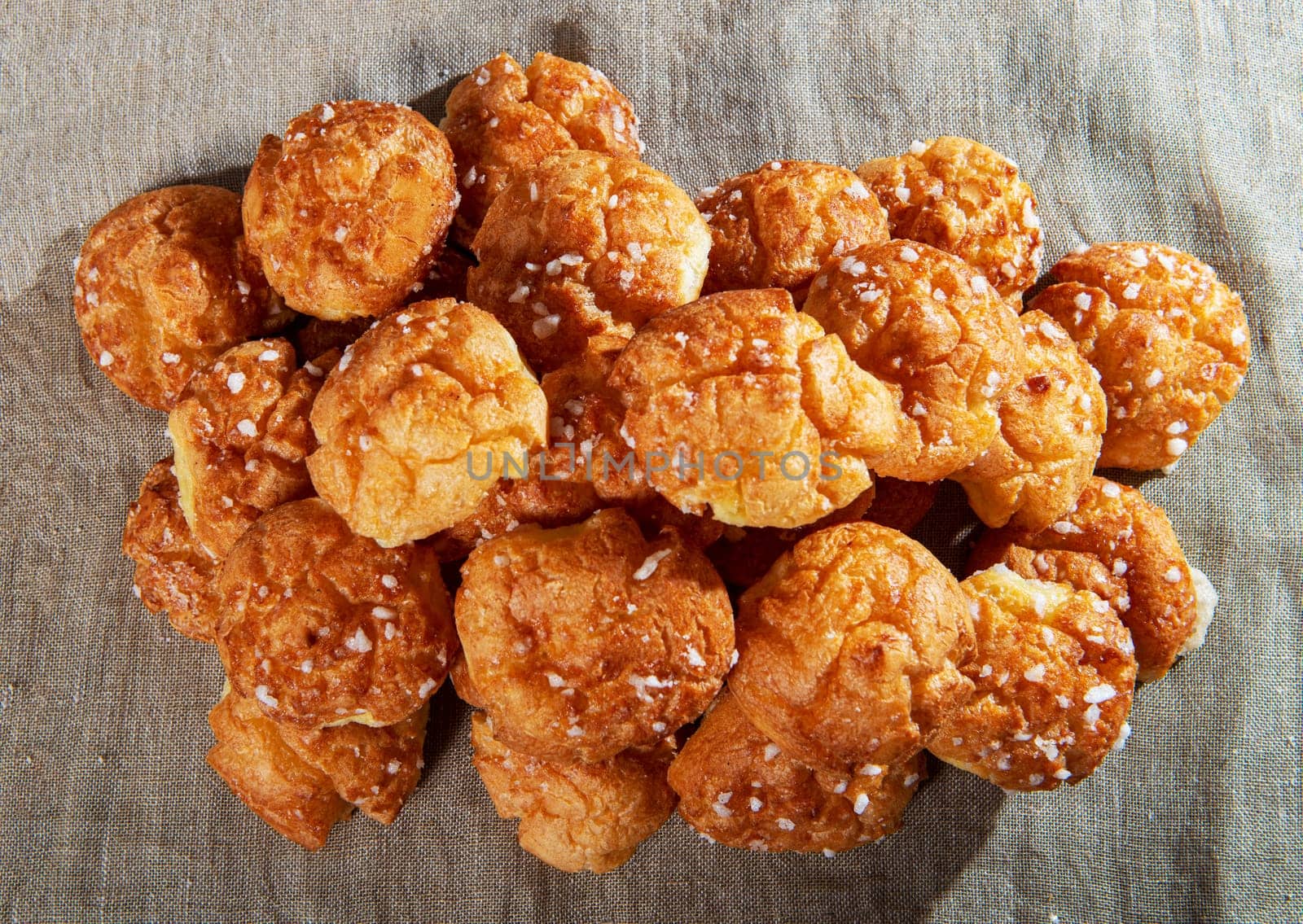 Chouquette, the french choux pastry on the wooden table