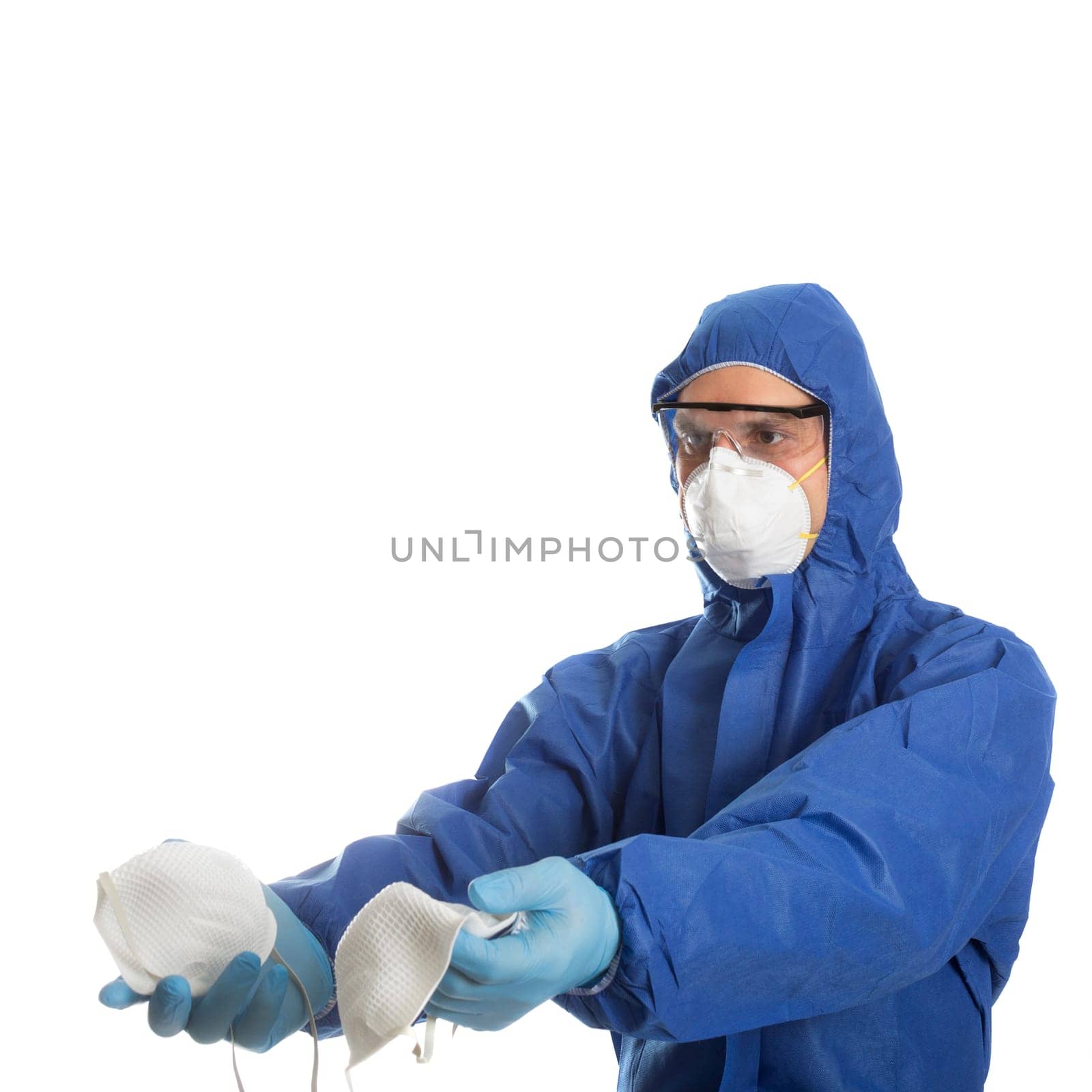Man in protective clothing give face masks to someone. Coronavirus concept.