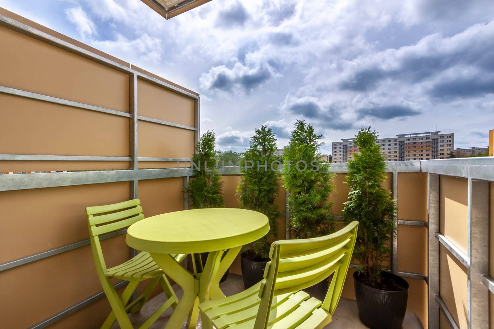 sitting on the balcony of the apartment - High quality photo
