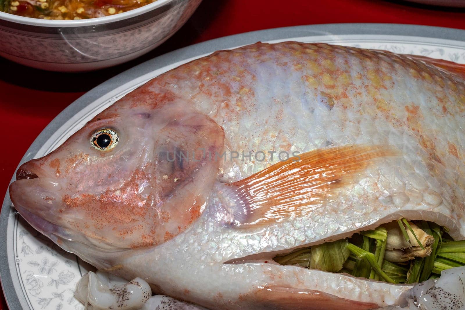 red tilapia fish seafood  eye fresh raw spices