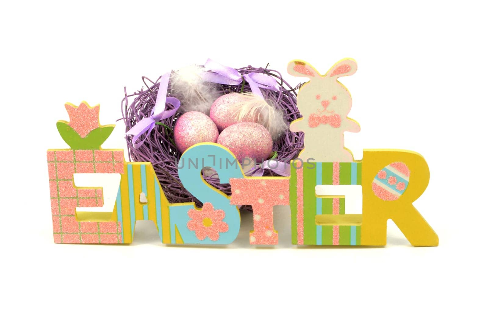 An isolated over white background image of a colorful Easter cutout sign with a purple nest and eggs for the holiday season.