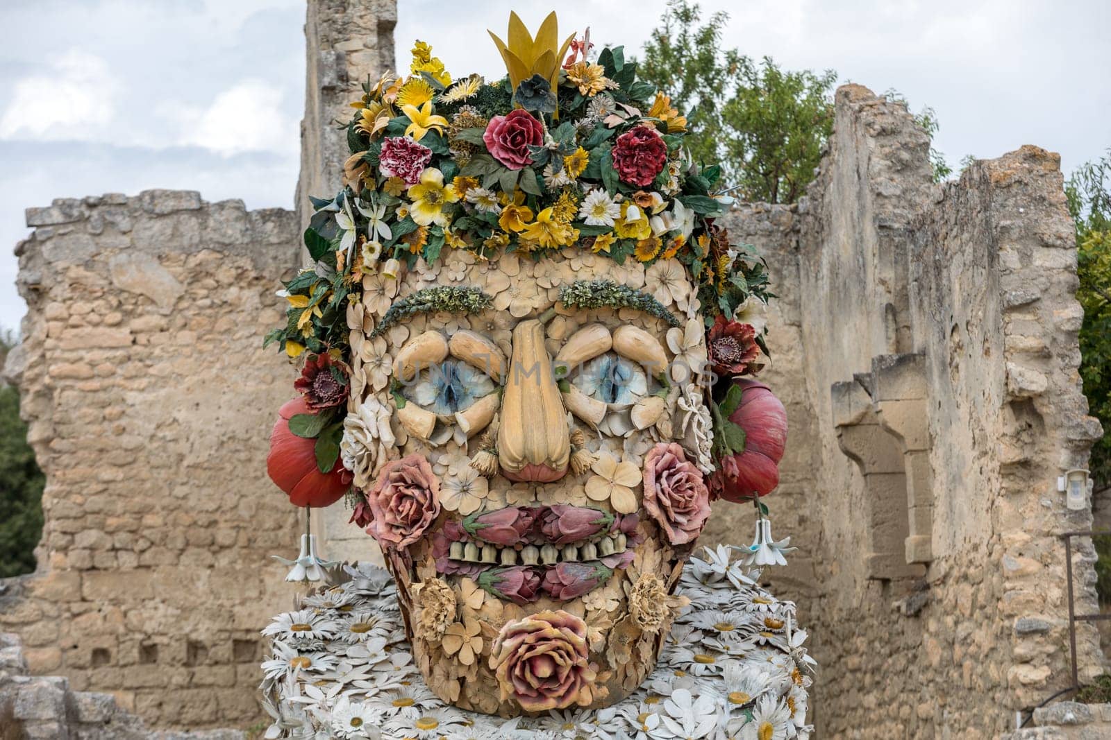 Les Baux, France - June 26, 2017: The artwork, titled Spring is Four Seasons three-dimensional interpretations created by Philip Haas and inspired by a set of paintings with the same titles by Italian Renaissance artist Giuseppe Arcimbaldo. Each season is represented by the bust of an oversized figure composed of fruits, flowers, and other vegetation symbolic of that time of year.
