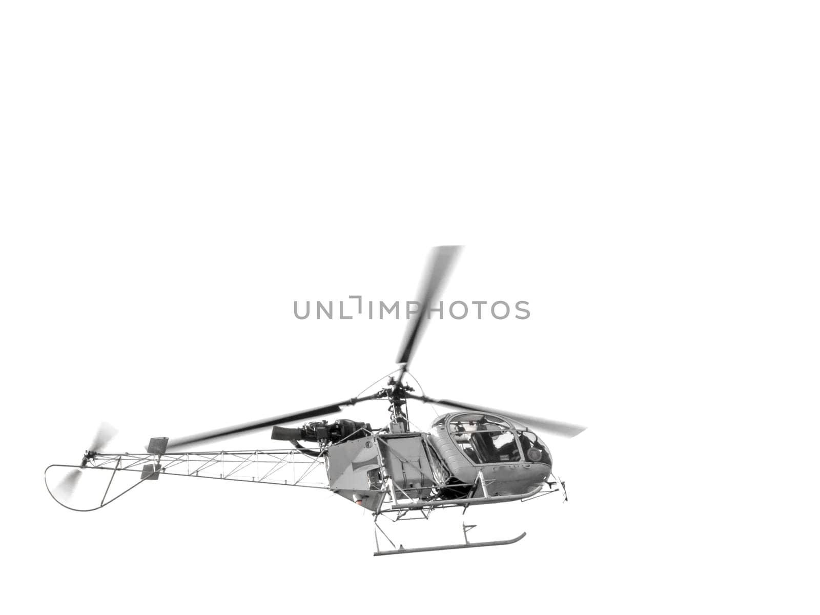 Helicopter flying against white background