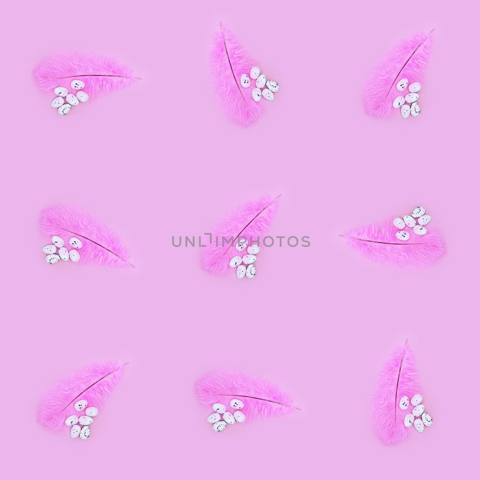 Seamless texture of pink feather and eggs on a pink background. Easter concept