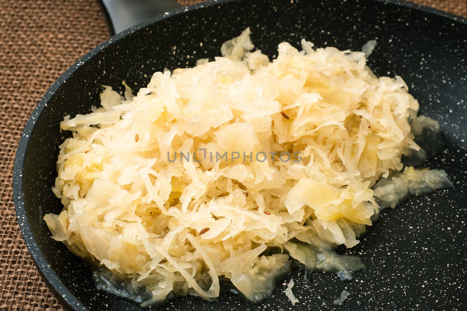 Fresh healthy sauerkraut in a frying pan
