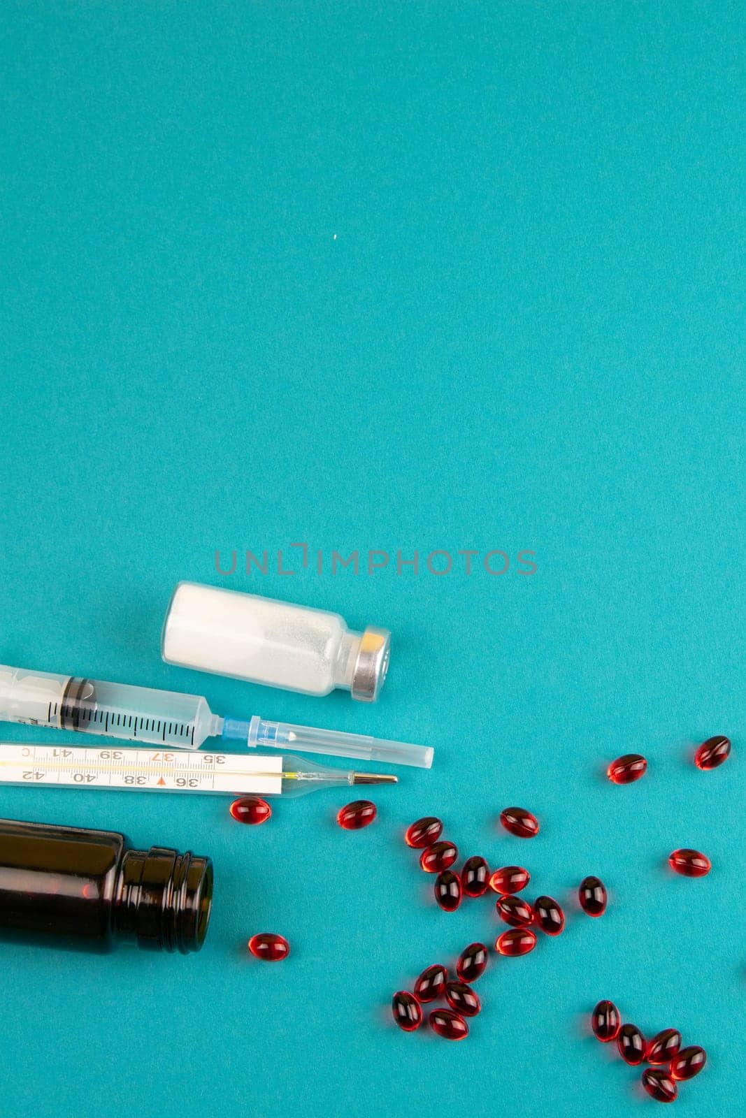 Lemon, ginger, and chapel against multi-colored tablets. The concept of choosing a healthy diet versus taking medication. Top views with clear space
