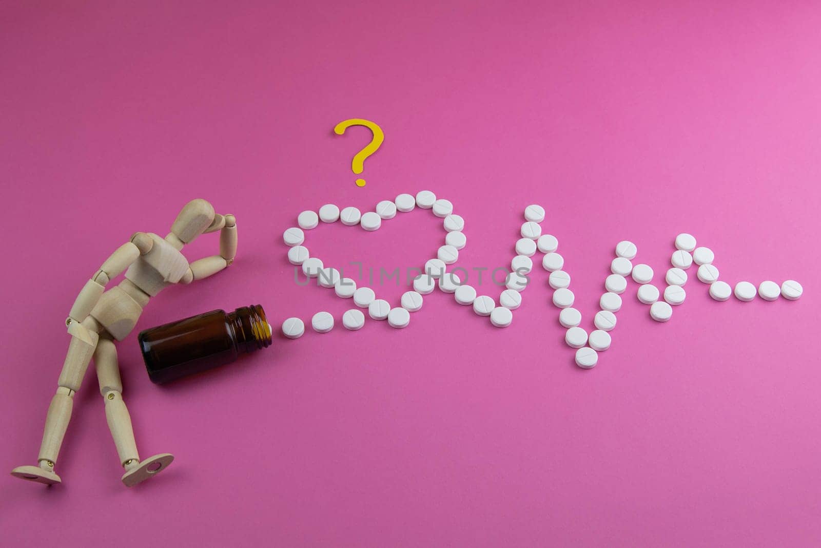 Lemon, ginger, and chapel against multi-colored tablets. The concept of choosing a healthy diet versus taking medication. Top views with clear space