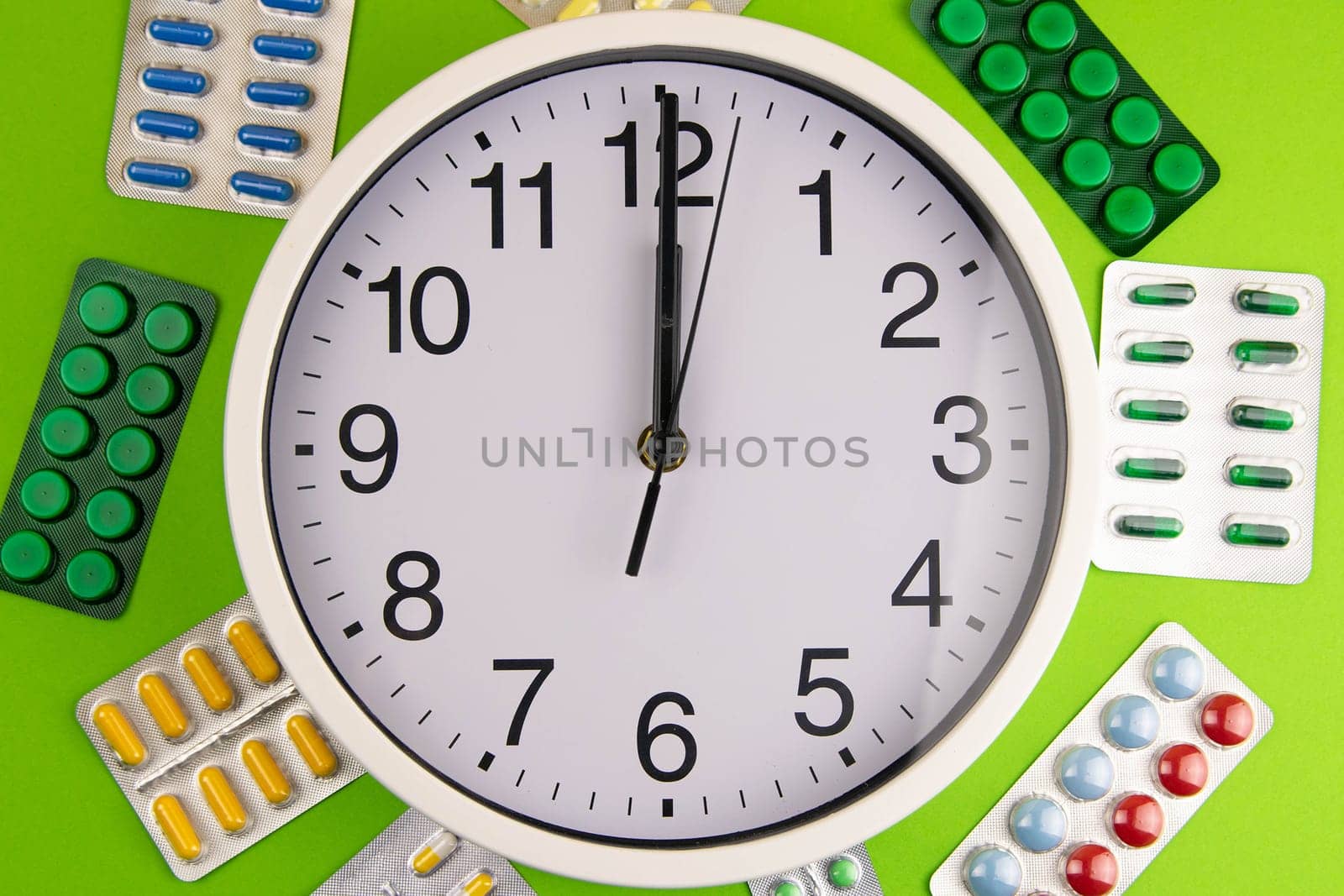 Pills of different colours lay on blue background. Colorful antibacterials pills, capsules of medicine.