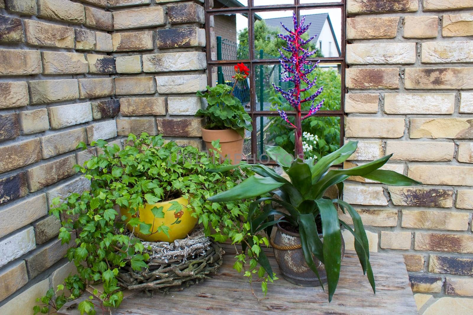 beautiful place in the garden in the mediterranean style, pots with plants on the table