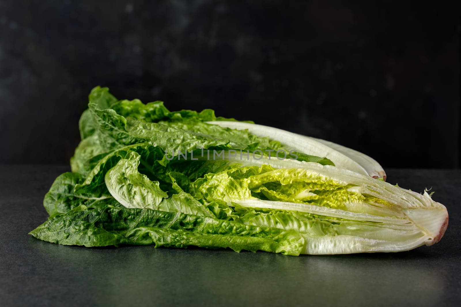 Lettuce Roman Lettuce on a dark background in a cut