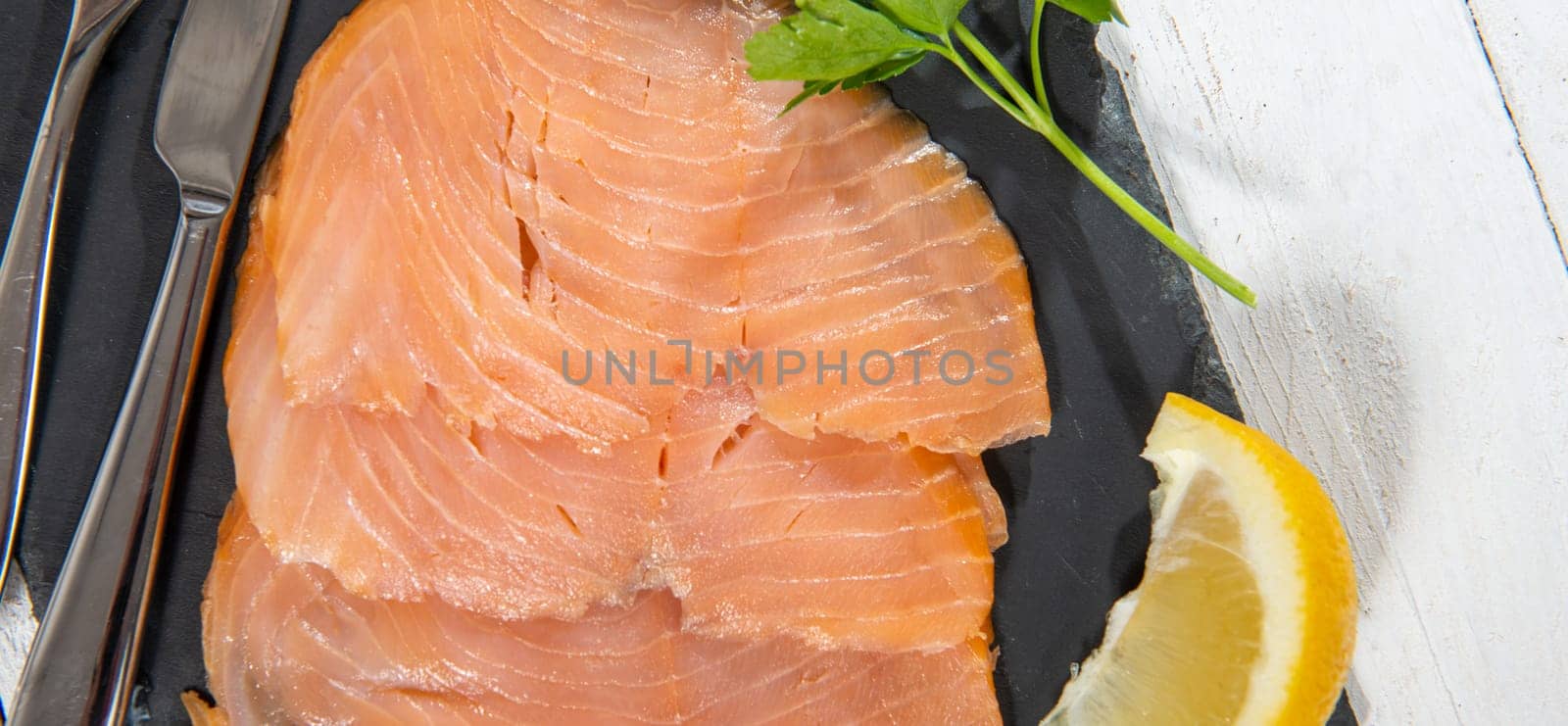 Delicious raw salmon fish fillets on the white wooden