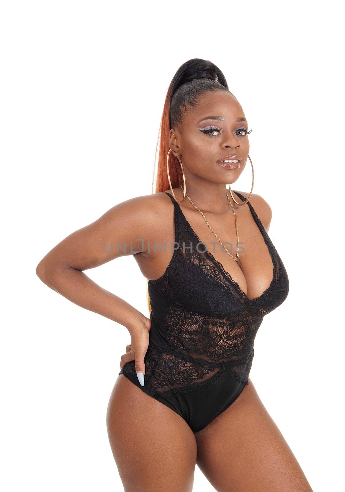 A lovely young African American woman standing in a black body suit,.smiling, isolated for white background.