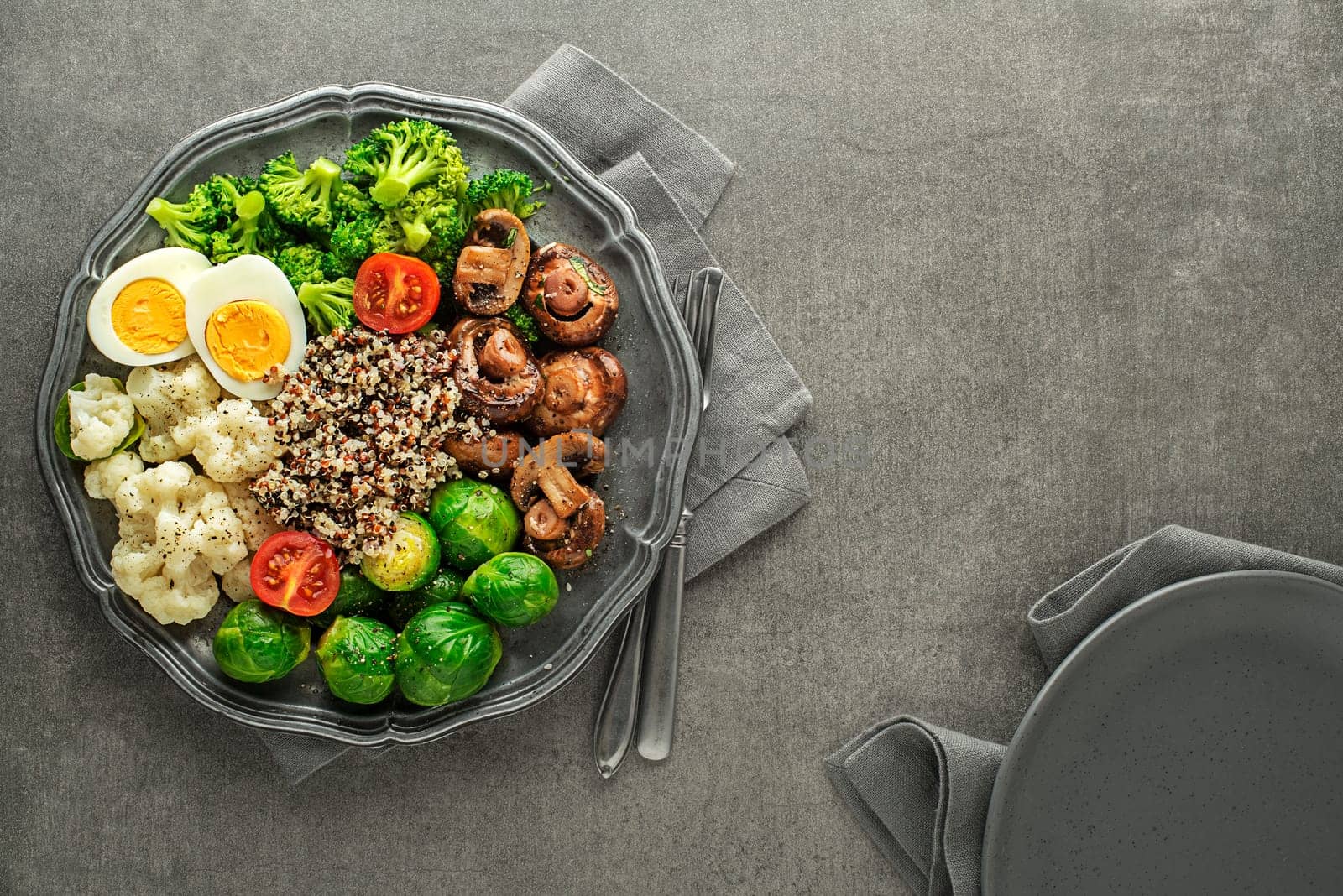 Healthy meal with cooked and roasted vegetables and quinoa seeds. Healthy vegetable diet meal.