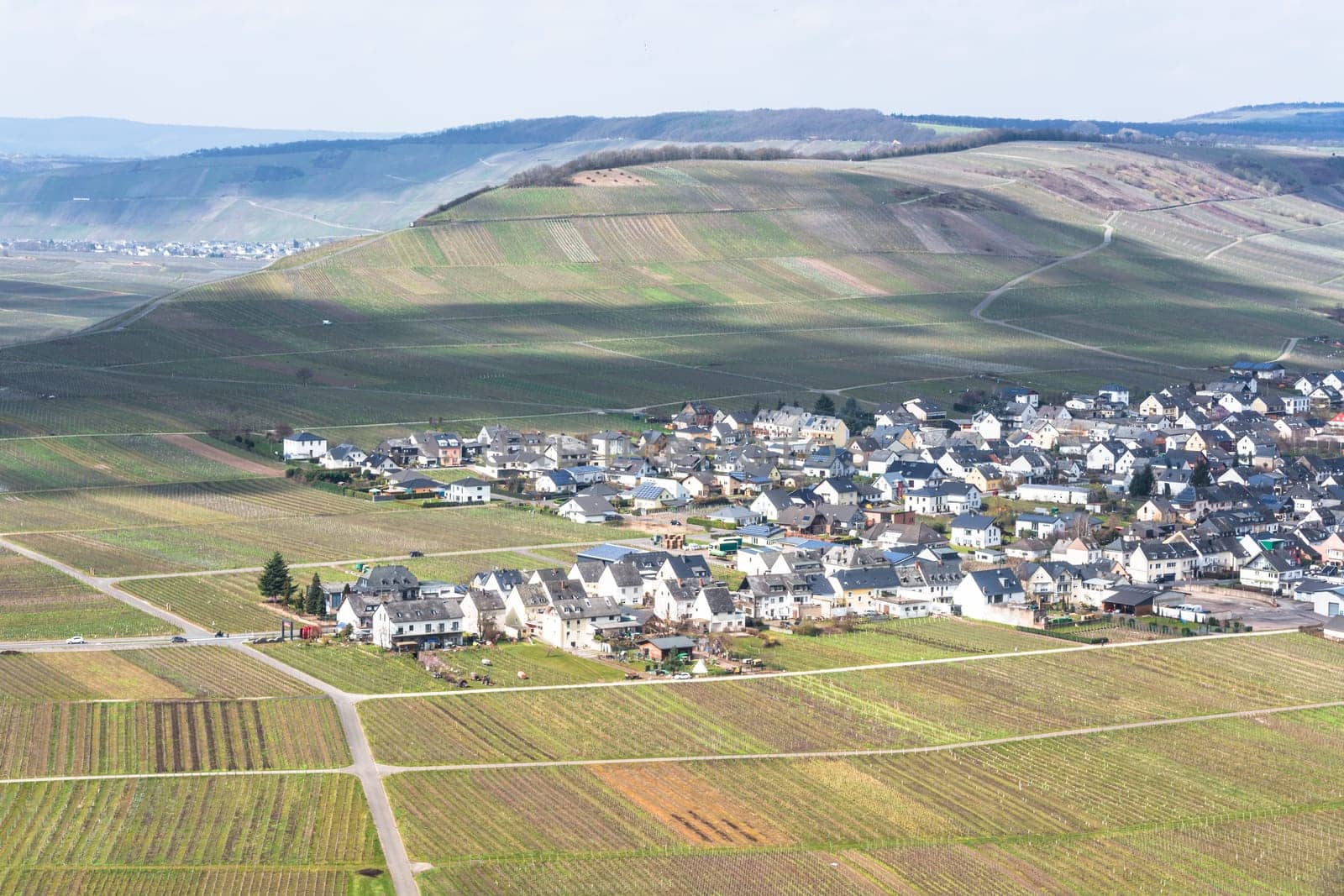 MOSELTAL, GERMANY - MARCH 26, 2016:.Panoramic view over the Moselle valley in the background the vineyards and the River Moselle.