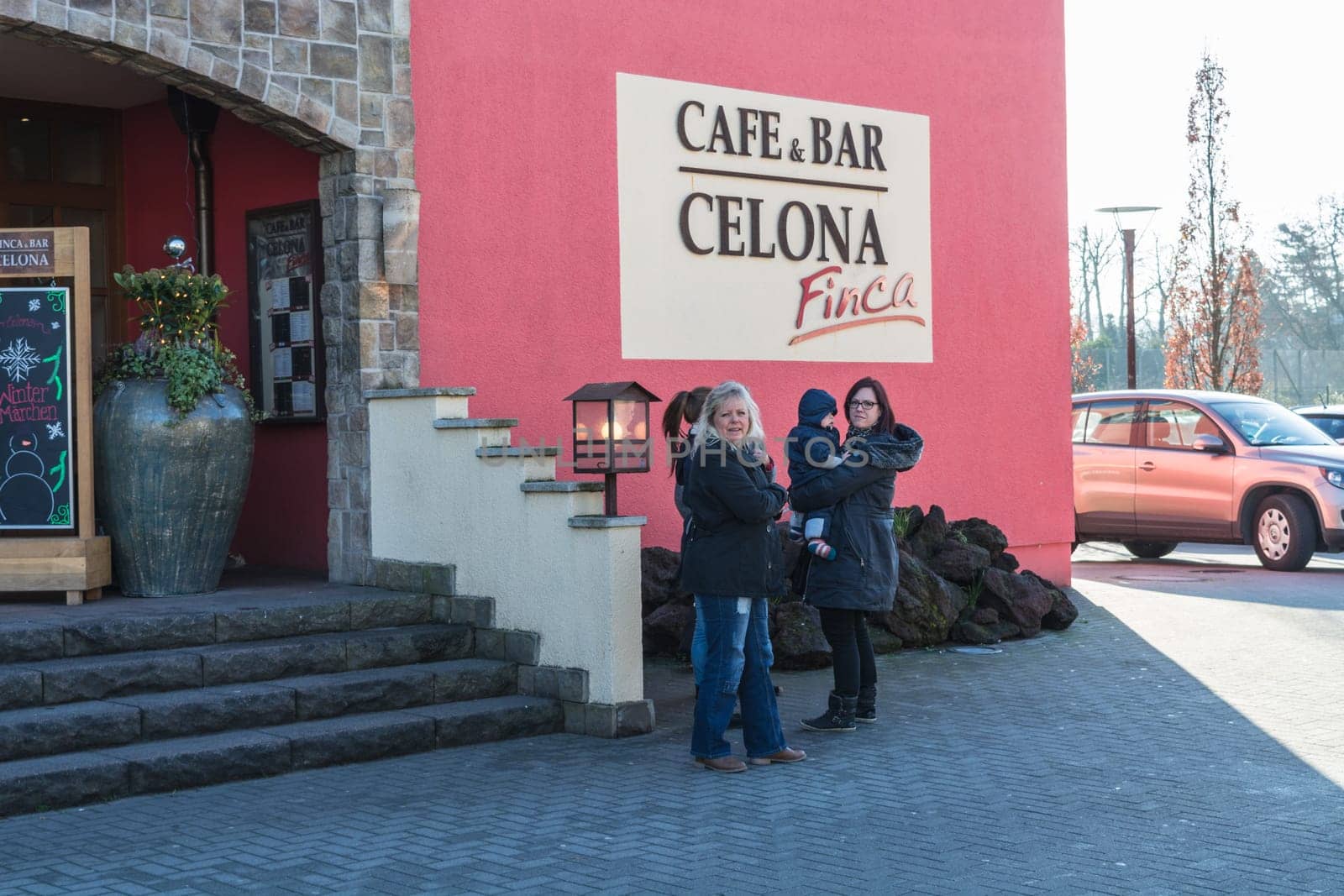 ESSEN STEELE, NRW, GERMANY - NOVEMBER 27, 2015:.A group of women in front of the entrance of Finca & Bar Celona in Essen Steele, Germany.