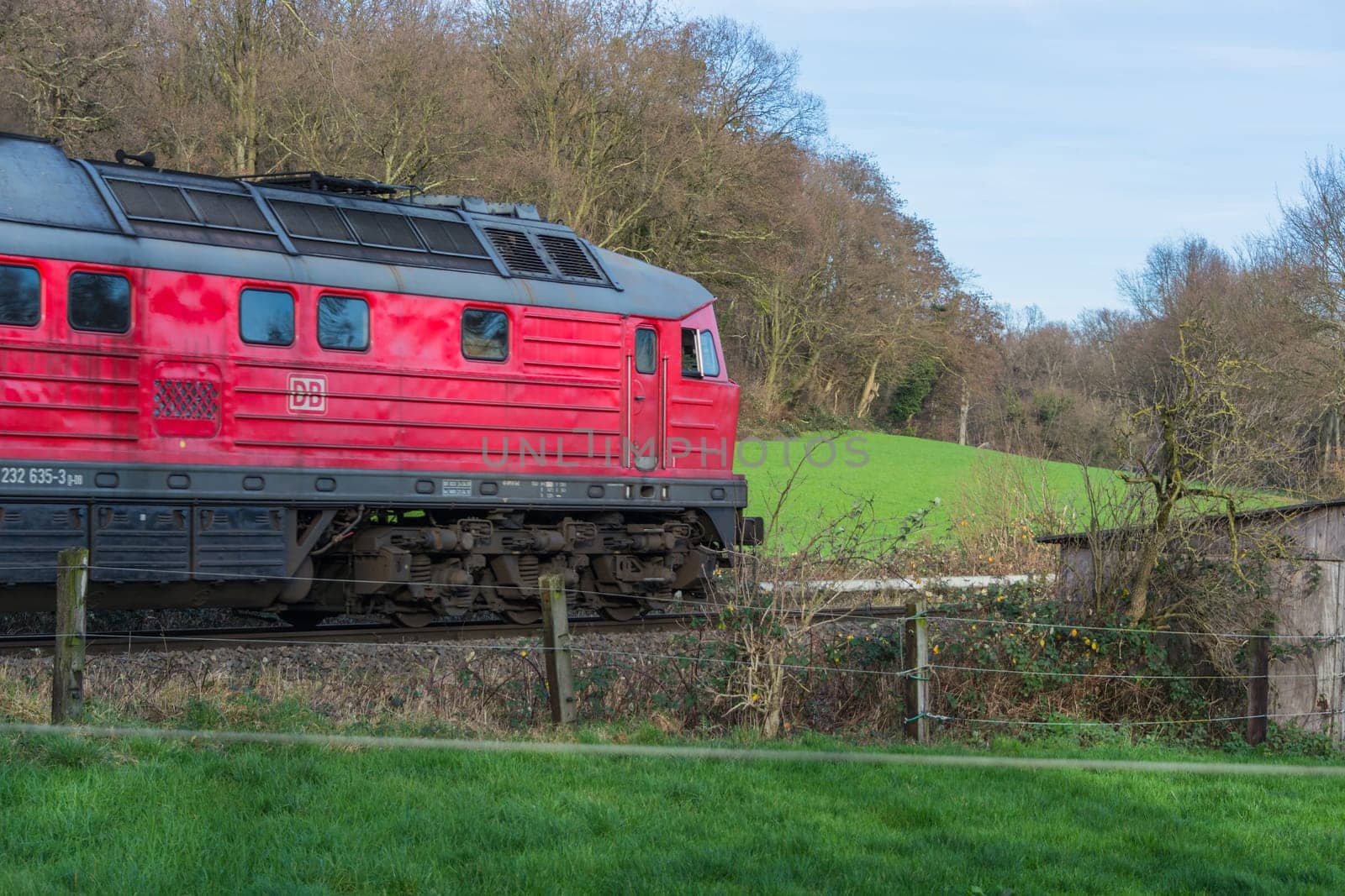 RATINGEN, NRW, GERMANY - DECEMBER 28, 2015:.Locomotive at the railroad crossing in Ratingen at the moated castle "house to house"". By propelled fast train towards Muelheim - food."