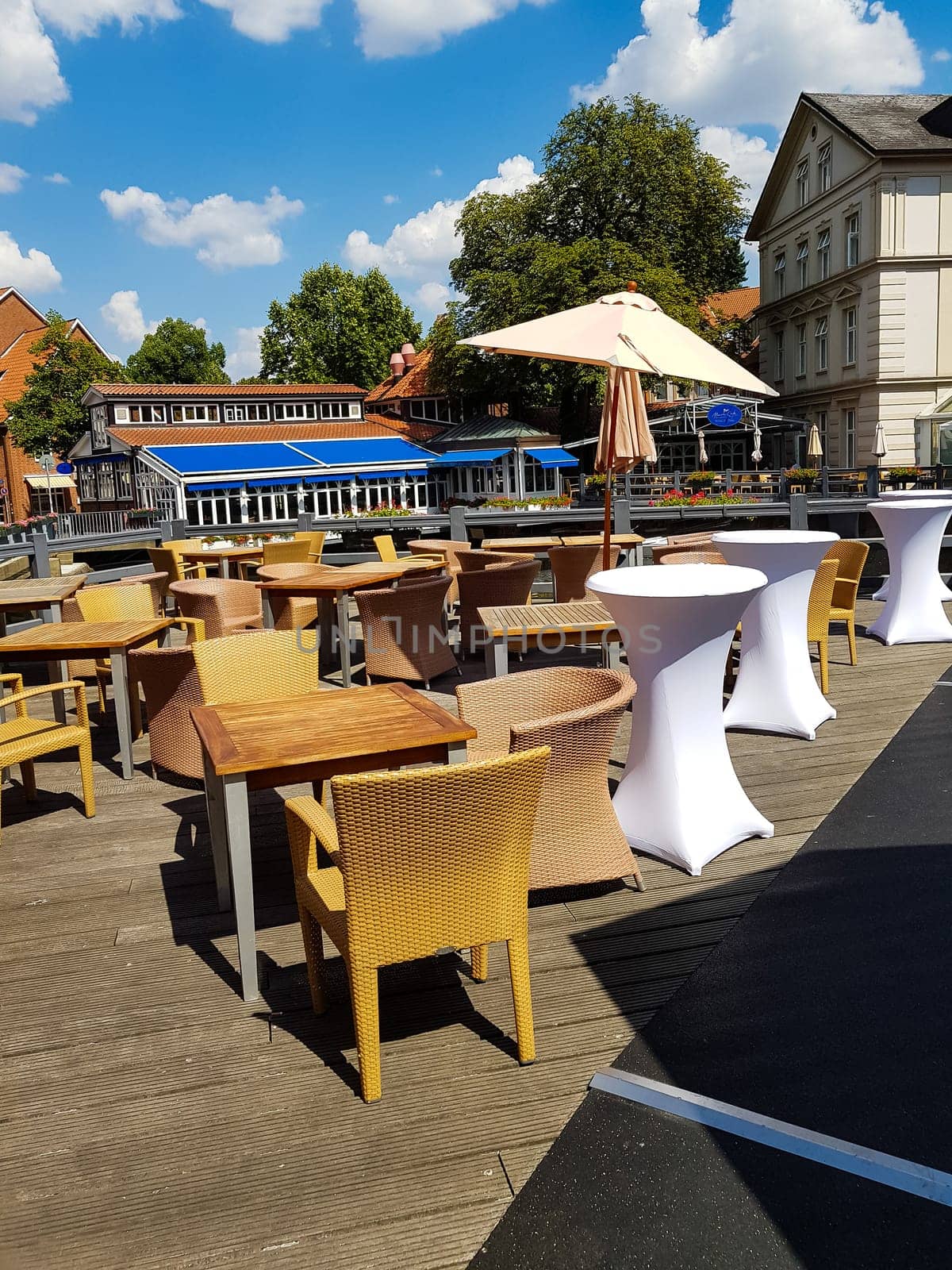 LUENBURG - JULLI 27, 2018:..Luenburg - Julli 27, 2018:.Restaurant Terrace in the center of the city Lüneburg in the background you can see the Romantik Hotel Bergström in the historic center of Lüneburg.