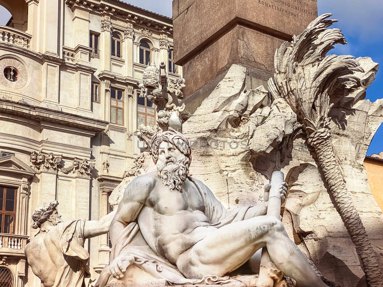 a seagull resting on the head of the statue representing the Ganges river in the Fountain of the four rivers in Piazza Navona in Rome. Travel and famous destinations