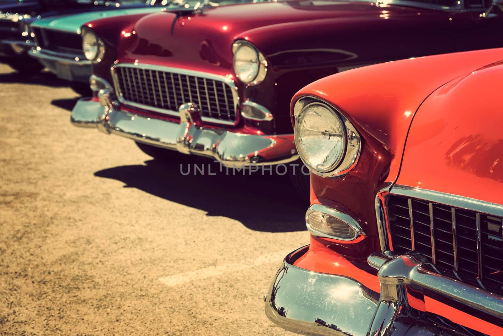 old cars parked in a row, vintage color