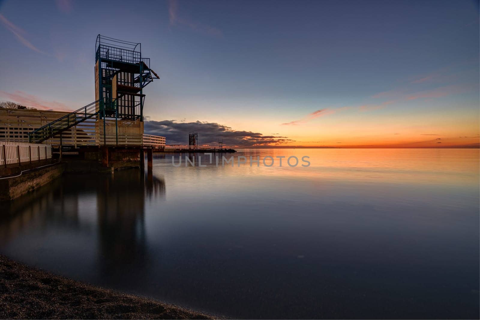 Seascape and wharf in the small bay of Anapa, Russia after sunset