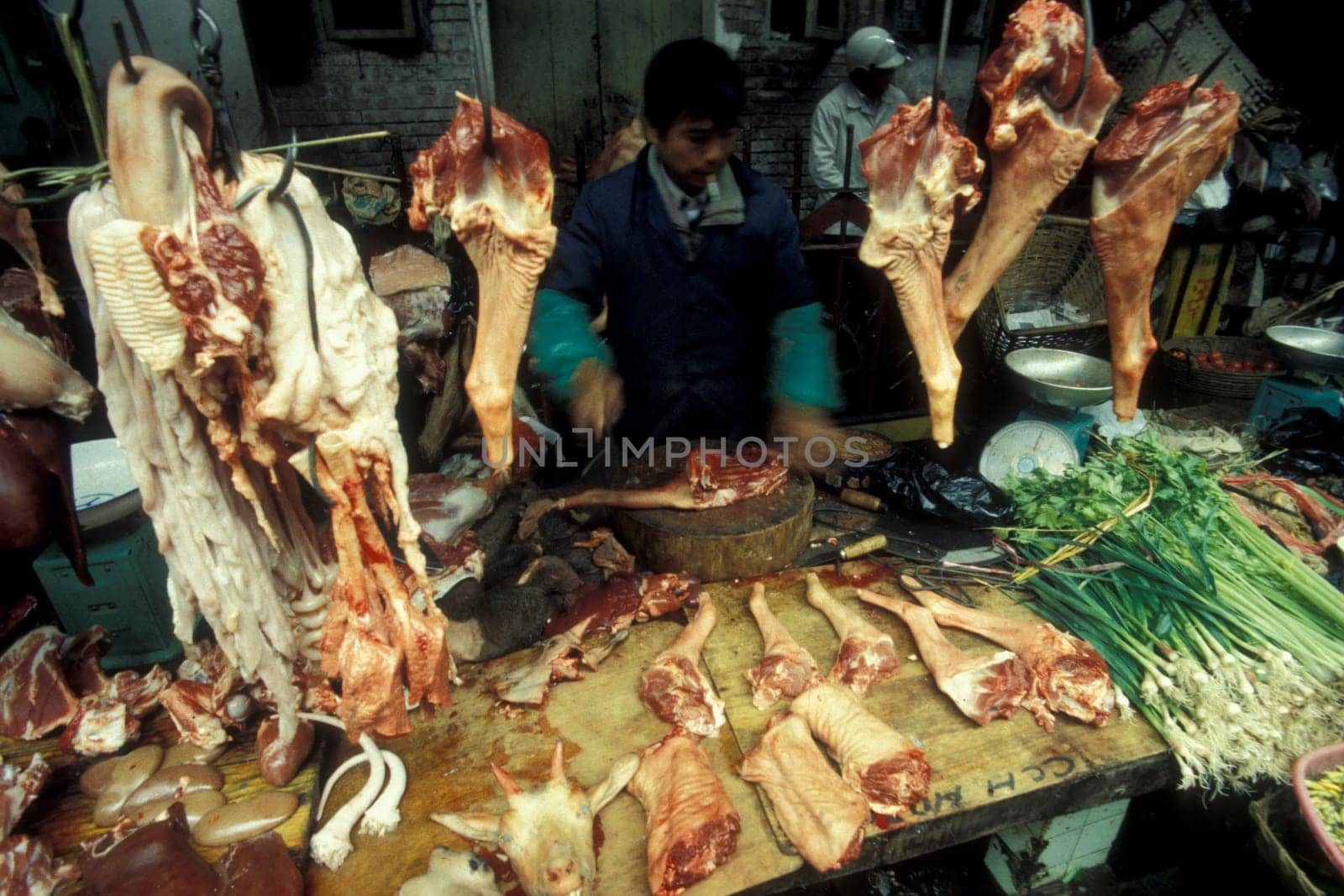 fresh meat at the meat and animal Market in the city of Guangzhou in the province of Guangdong in china in east asia.   China, Guangzhou, April, 2000