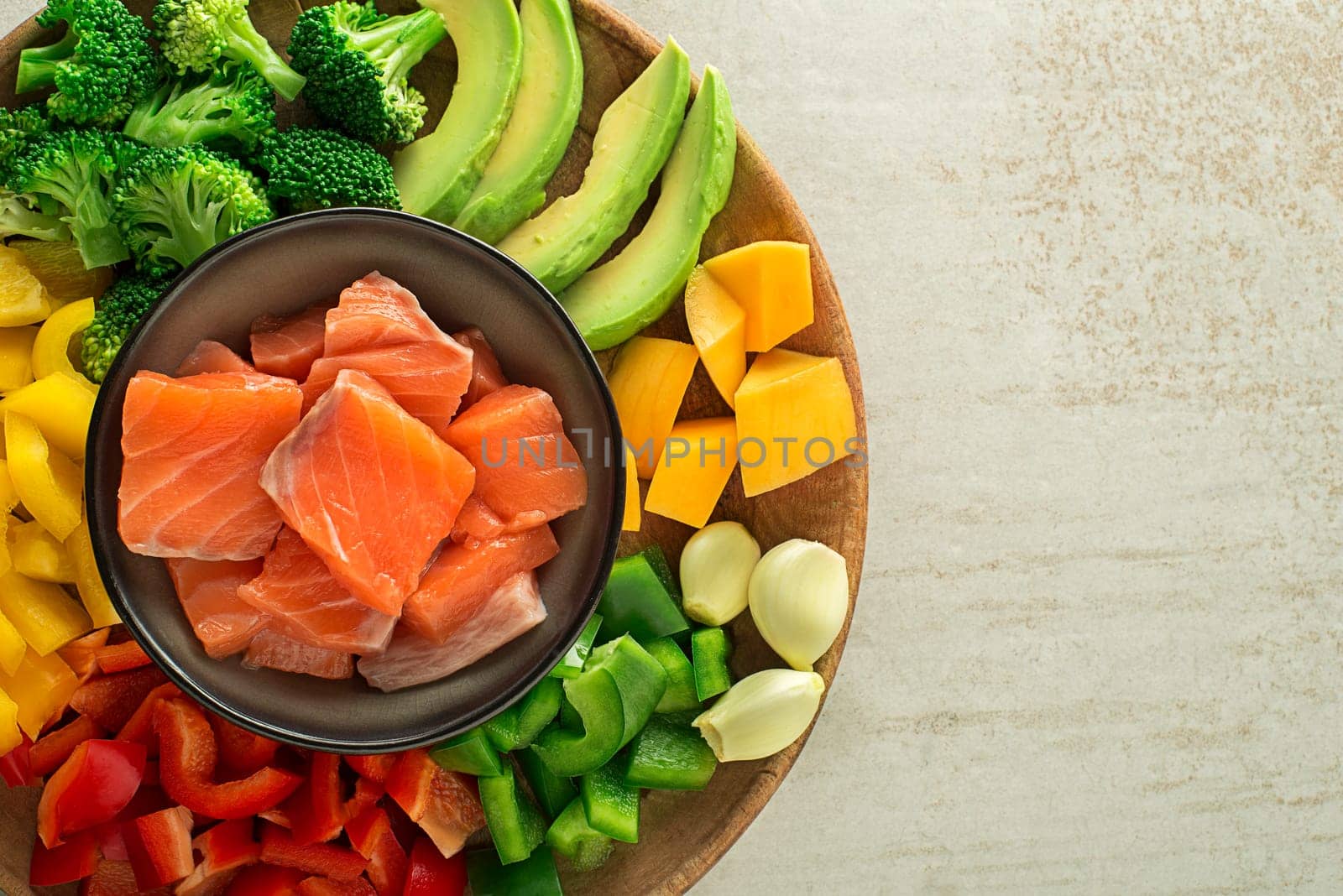 Cooking healthy meal with salmon steak and mixed vegetables. Healthy cooking concept