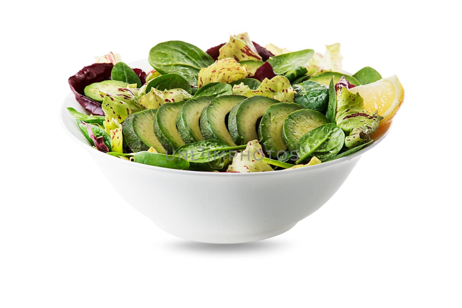 Healthy green salad with avocado isolated on white background