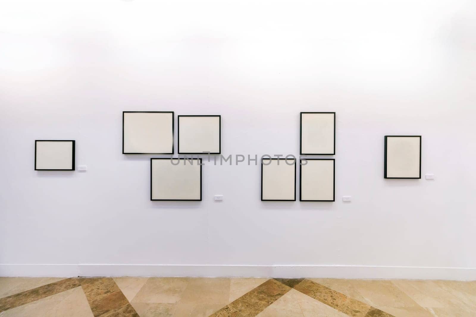 Close view of a bunch of empty blank frames on museum exhibition.