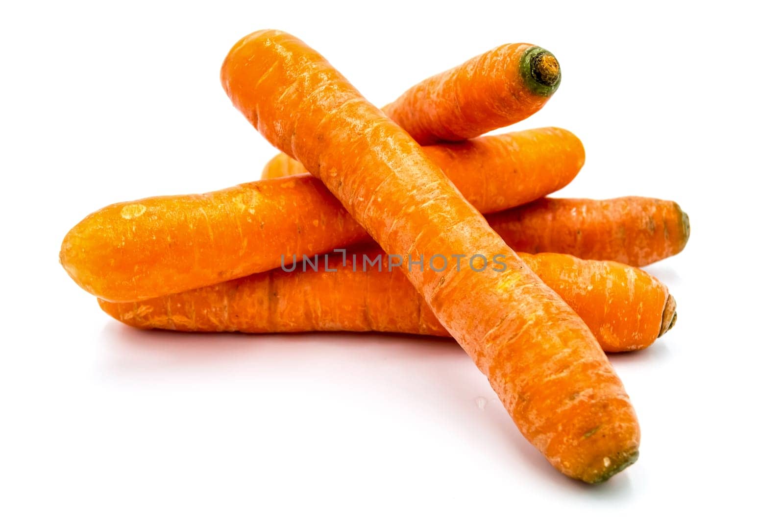 Ripe carrots isolated on white background