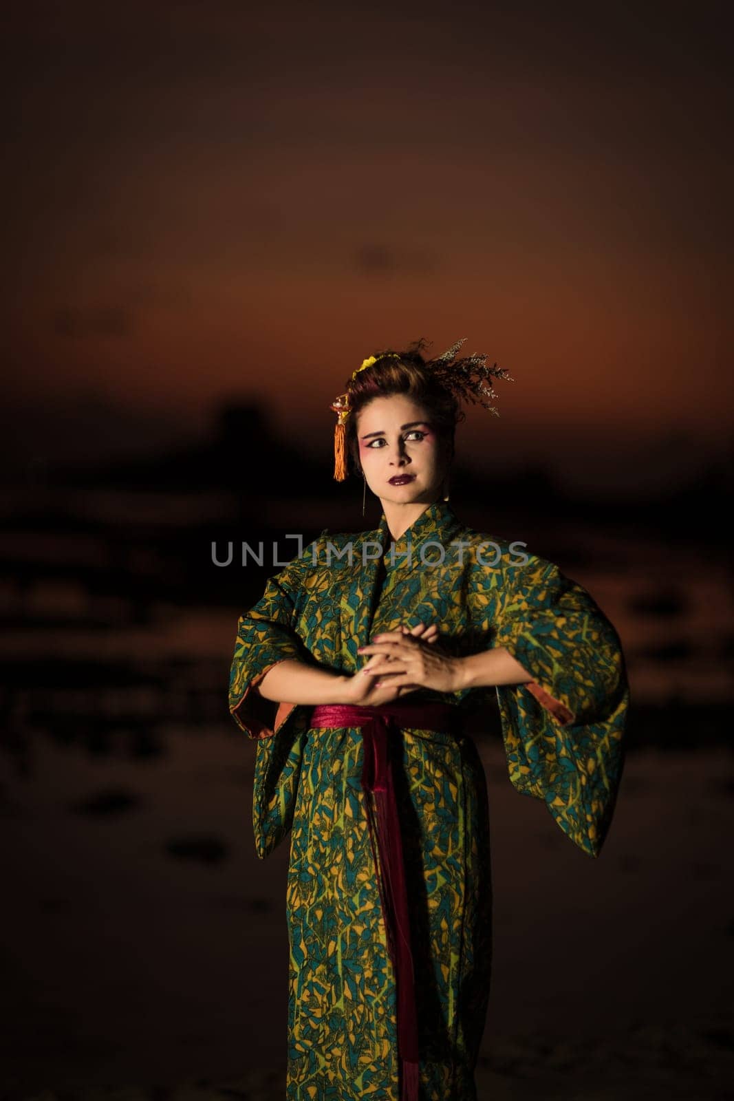 Fine art portrait of european woman in Japanese Geisha style wearing kimono