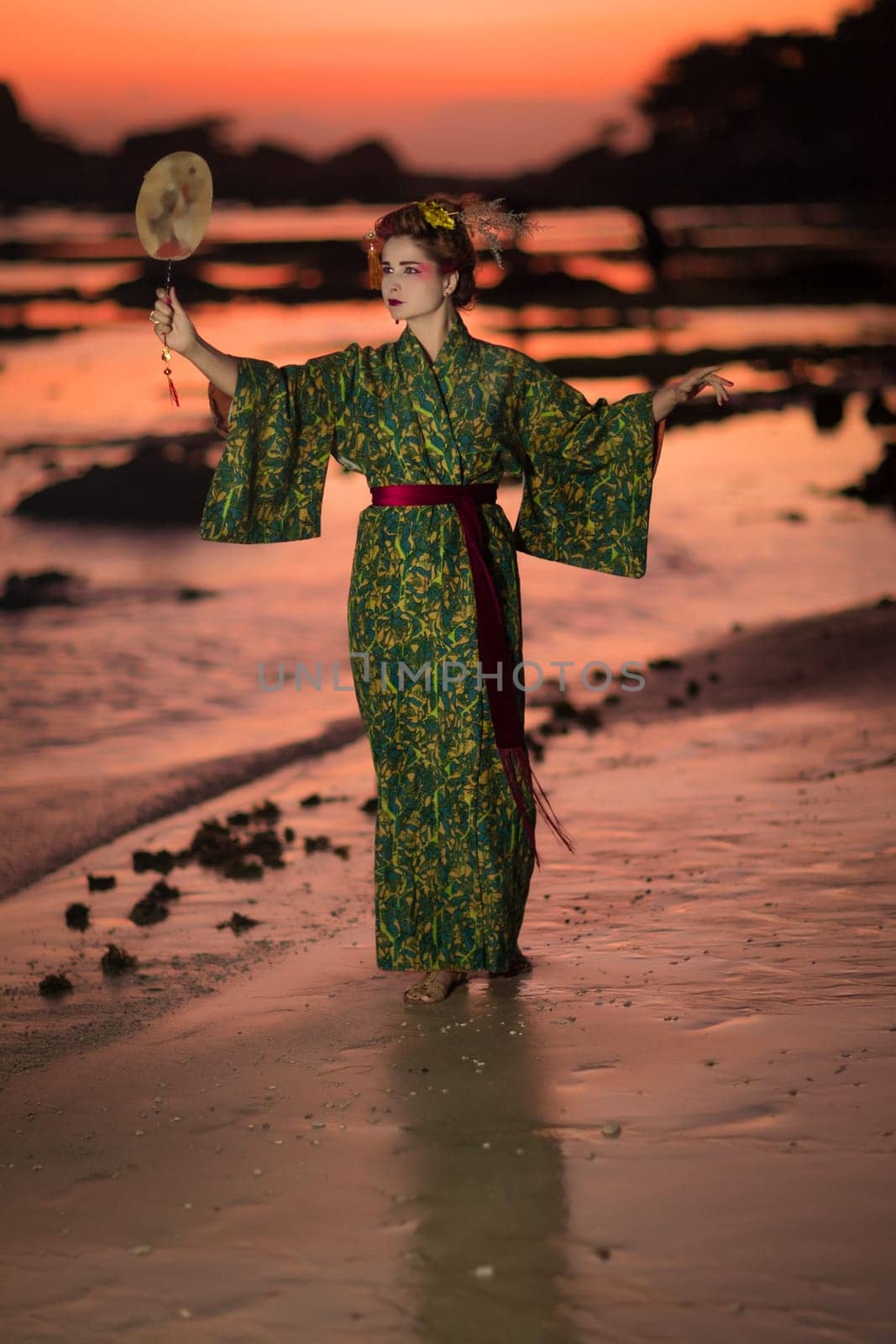 Fine art portrait of european woman in Japanese Geisha style wearing kimono
