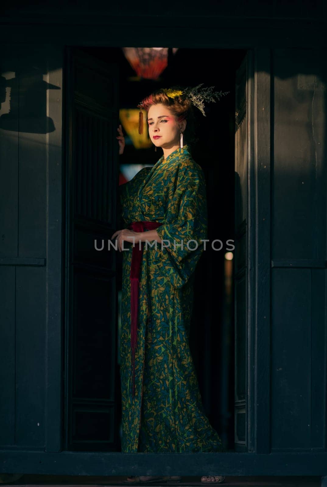 Fine art portrait of beautiful woman in Japanese Geisha style wearing kimono