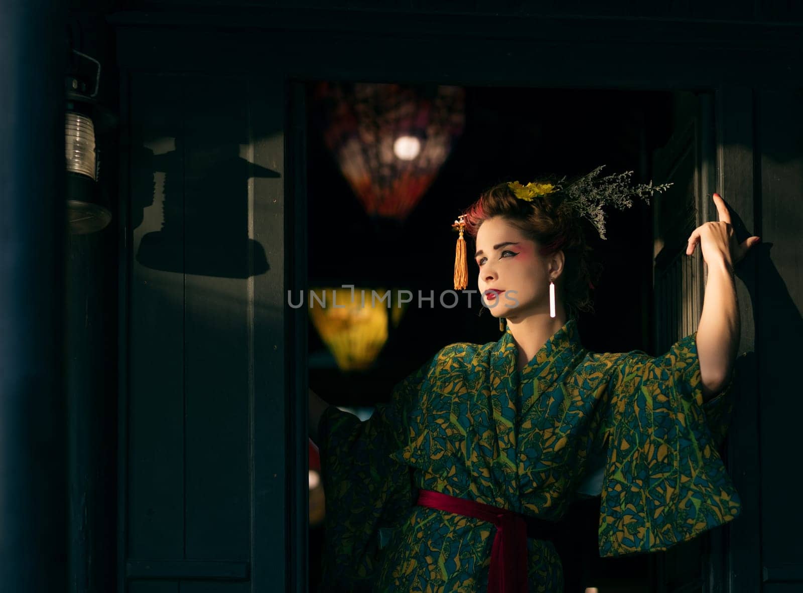 Fine art portrait of beautiful woman in Japanese Geisha style wearing kimono
