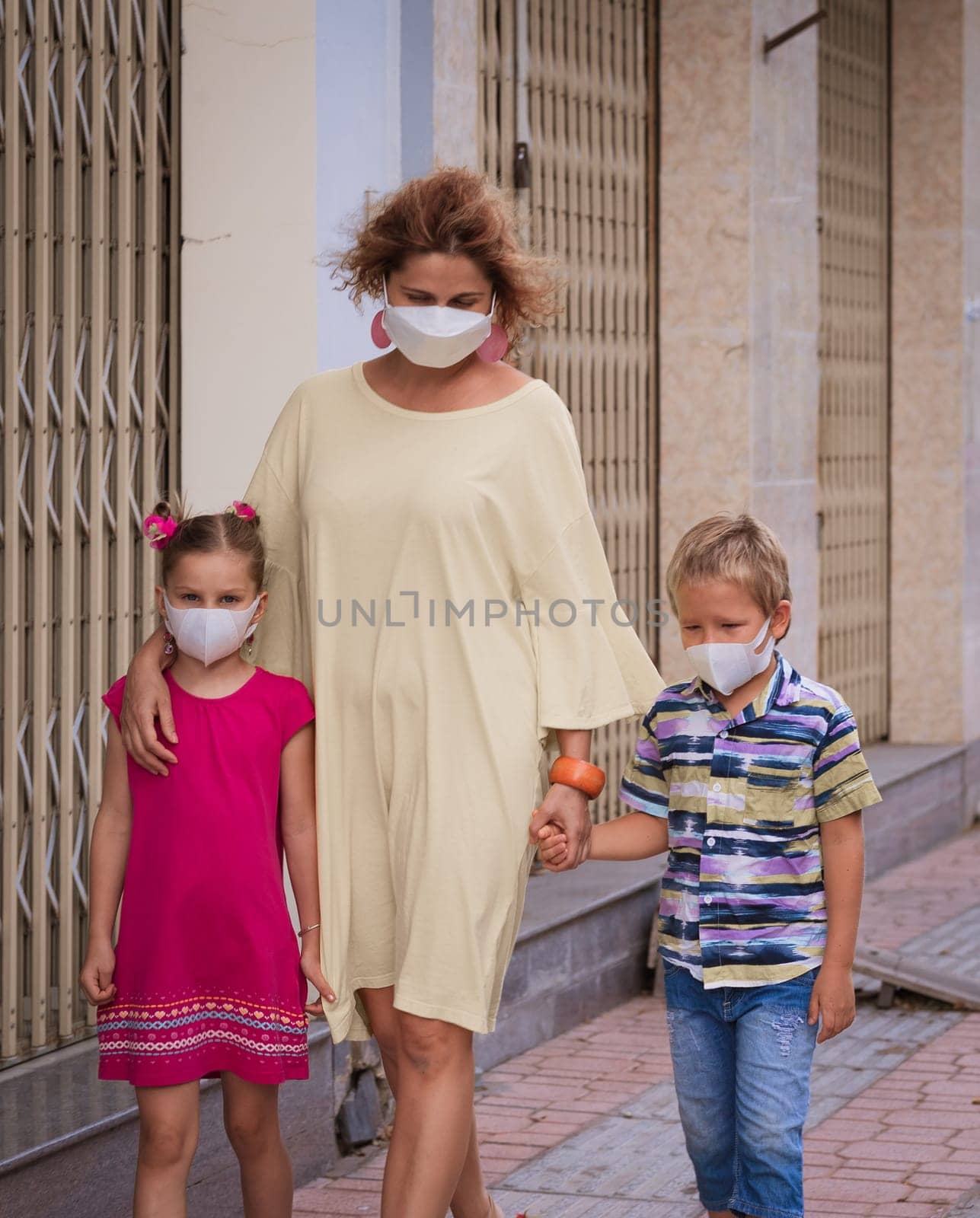 Family wearing facial disposable mask to avoid viral infection. Coronavirus protection