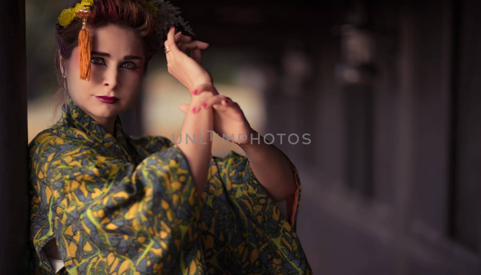 Fine art portrait of beautiful woman in Japanese Geisha style wearing kimono