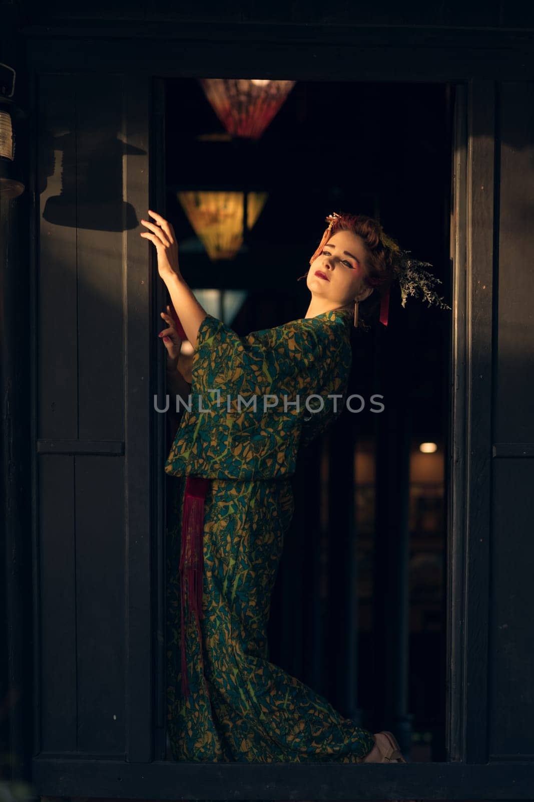 Fine art portrait of beautiful woman in Japanese Geisha style wearing kimono