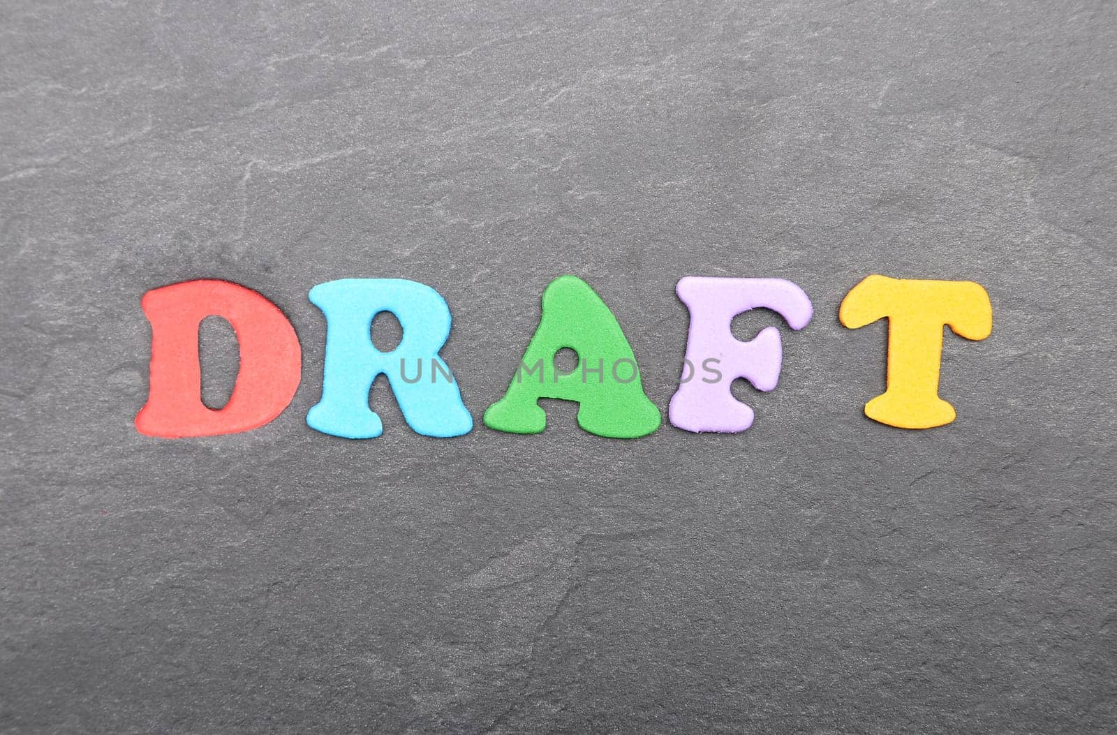Term from colorful letters on slate board