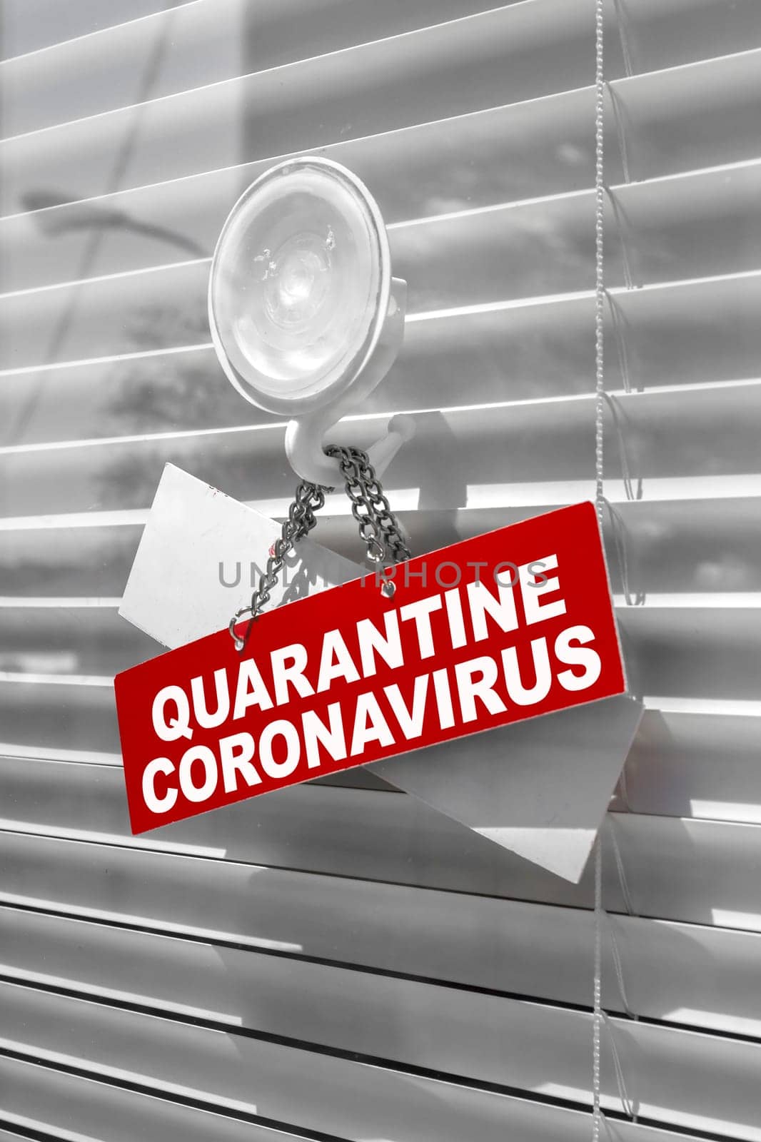 Red warning sign for Covid-19 in front of closed shop / office. Concept of stop working activities due to coronavirus medical emergency.